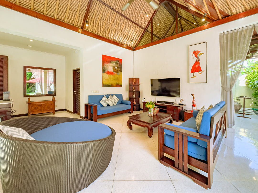 High-ceiling Balinese style open living pavilion at Villa Kebun Seminyak by Villa Bugis, a signature feature of this luxury Seminyak villas property.