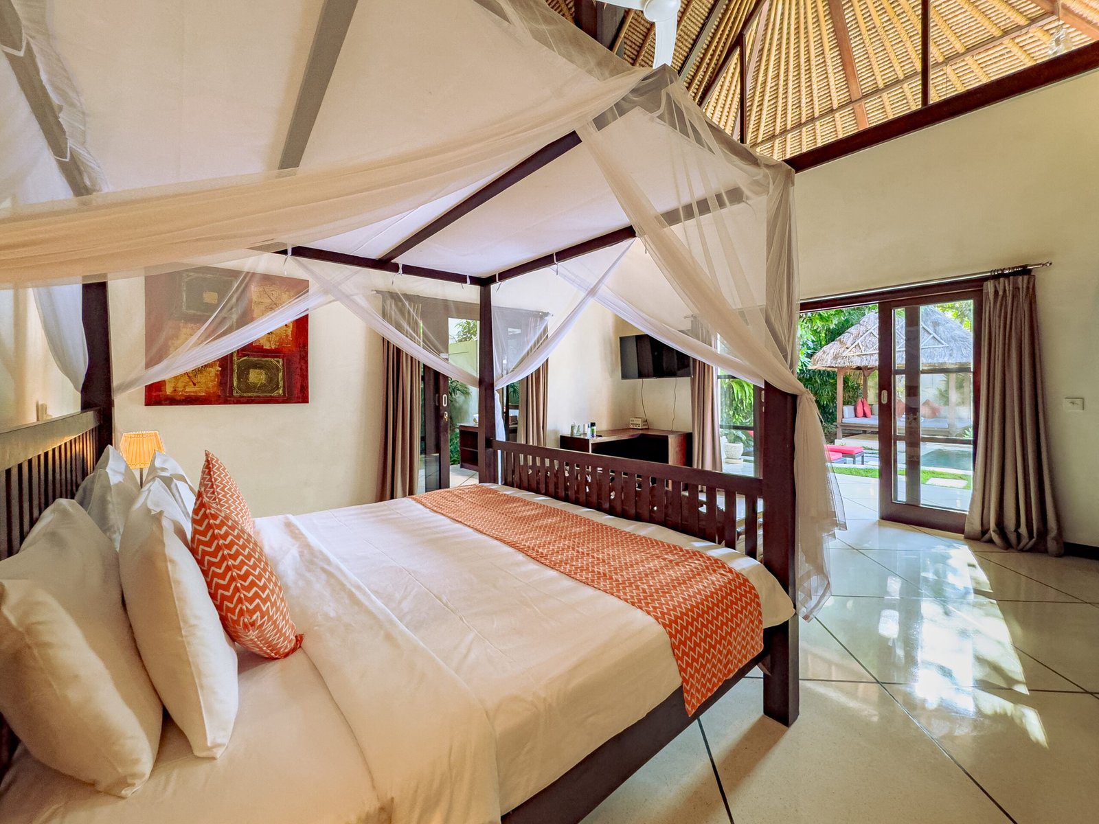Elegant master bedroom with a premium king-size bed setup at Villa Kebun Seminyak by Villa Bugis, a top-rated villa Seminyak for a relaxing stay.