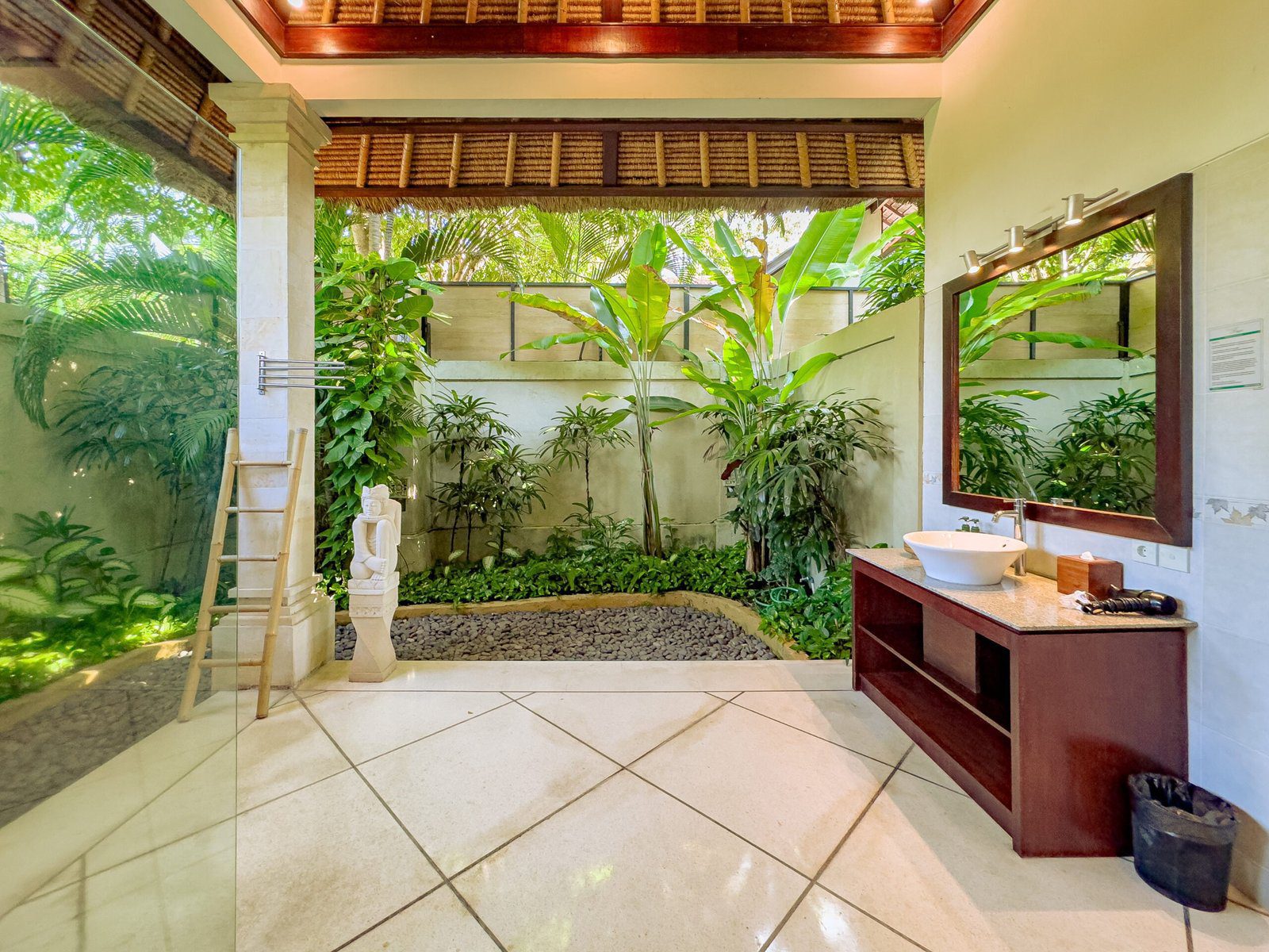 Ensuite luxury bathroom in the master suite at Villa Kebun Seminyak by Villa Bugis, featuring a beautiful semi-open tropical design villa Seminyak.