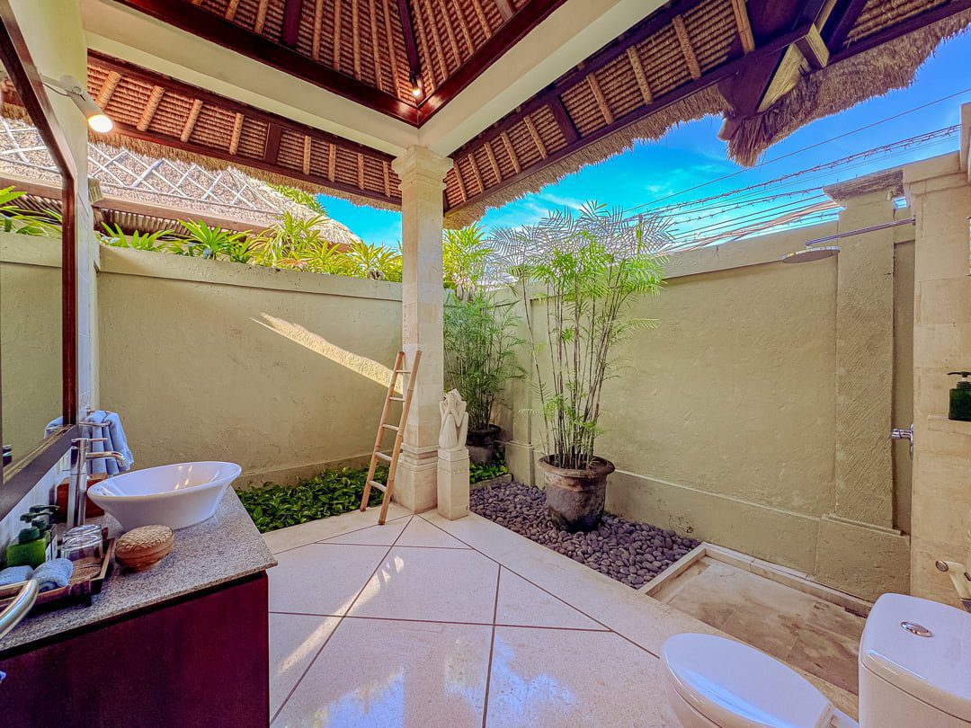 Semi-outdoor private bathroom attached to bedroom 2 at Villa Kebun Seminyak by Villa Bugis, offering a unique villa Seminyak bathing experience.
