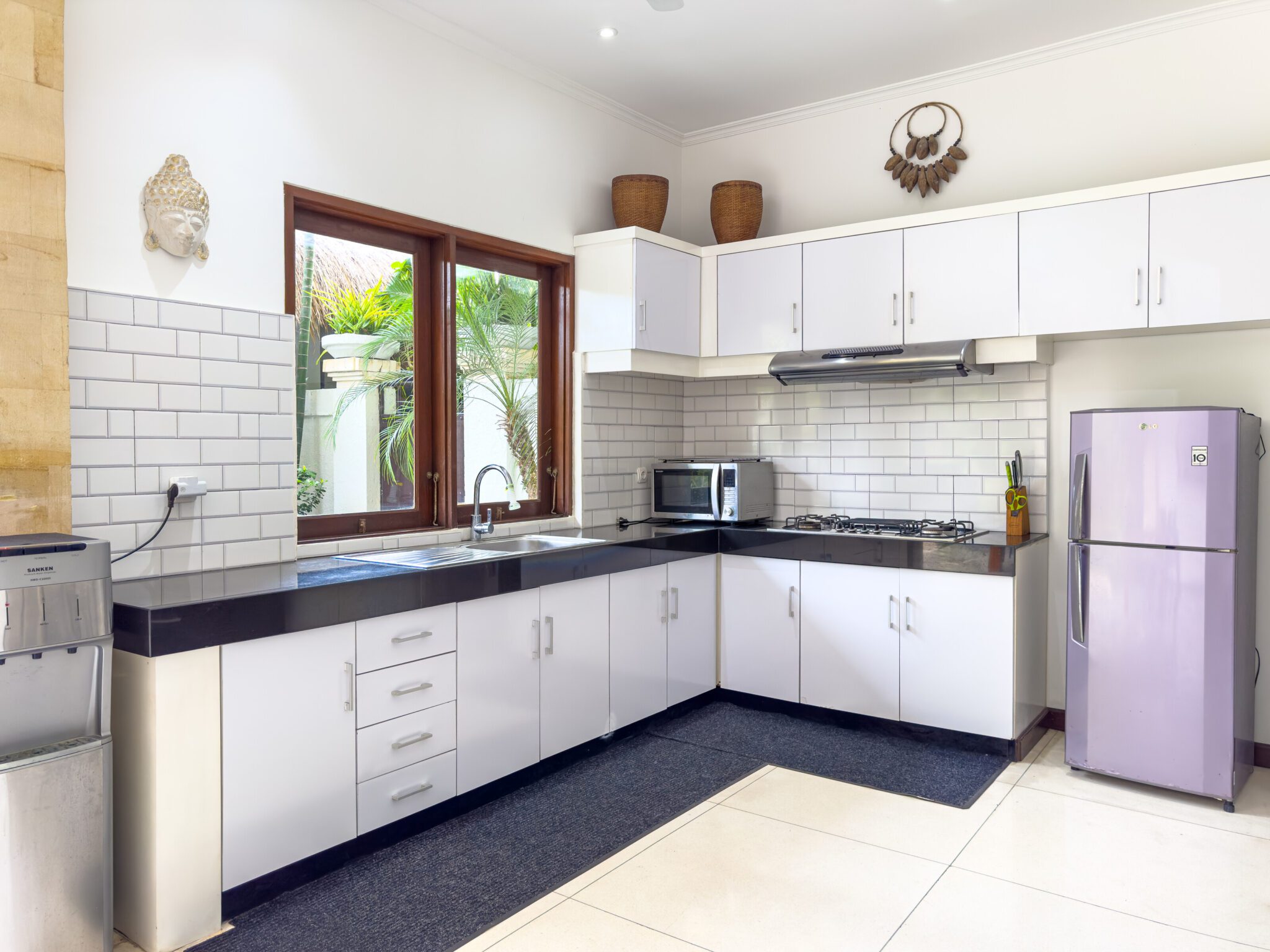 Spacious kitchen counter and dining preparation area at Villa Krisna Seminyak by Villa Bugis, offering self-catering convenience in Seminyak villas.