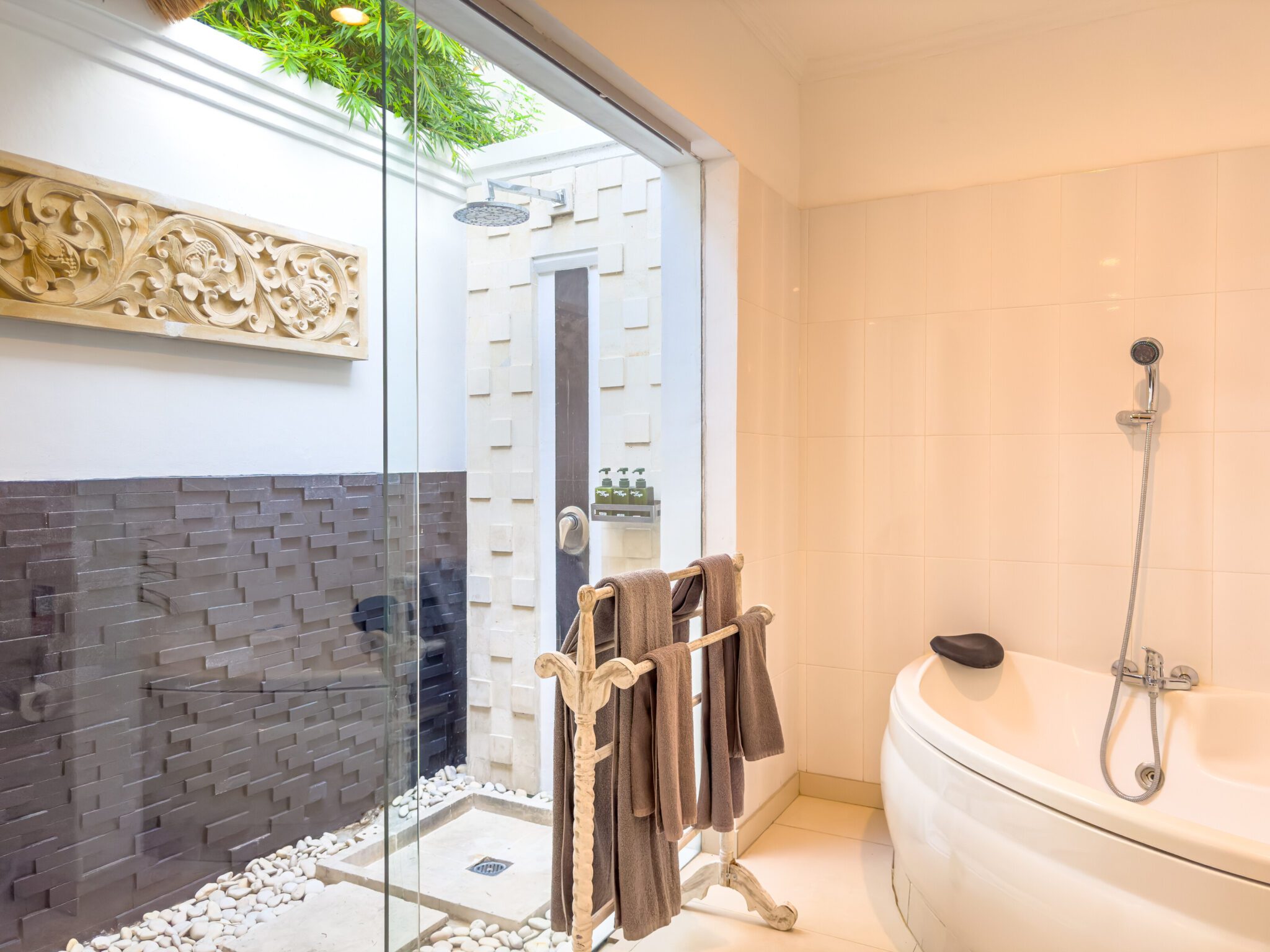 Pristine vanity setup and clean shower space inside the open-air bathroom of bedroom 2 at Villa Krisna Seminyak by Villa Bugis villa Seminyak.
