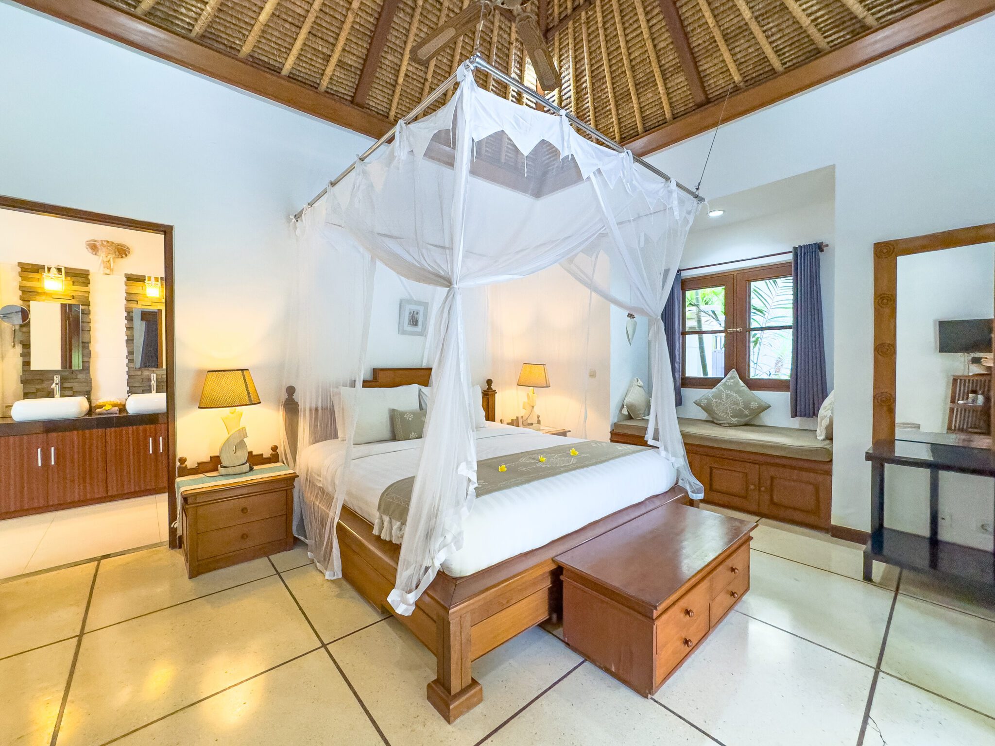 Tastefully decorated interior of bedroom 2 at Villa Krisna Seminyak by Villa Bugis villa Seminyak, featuring soft natural daylighting.
