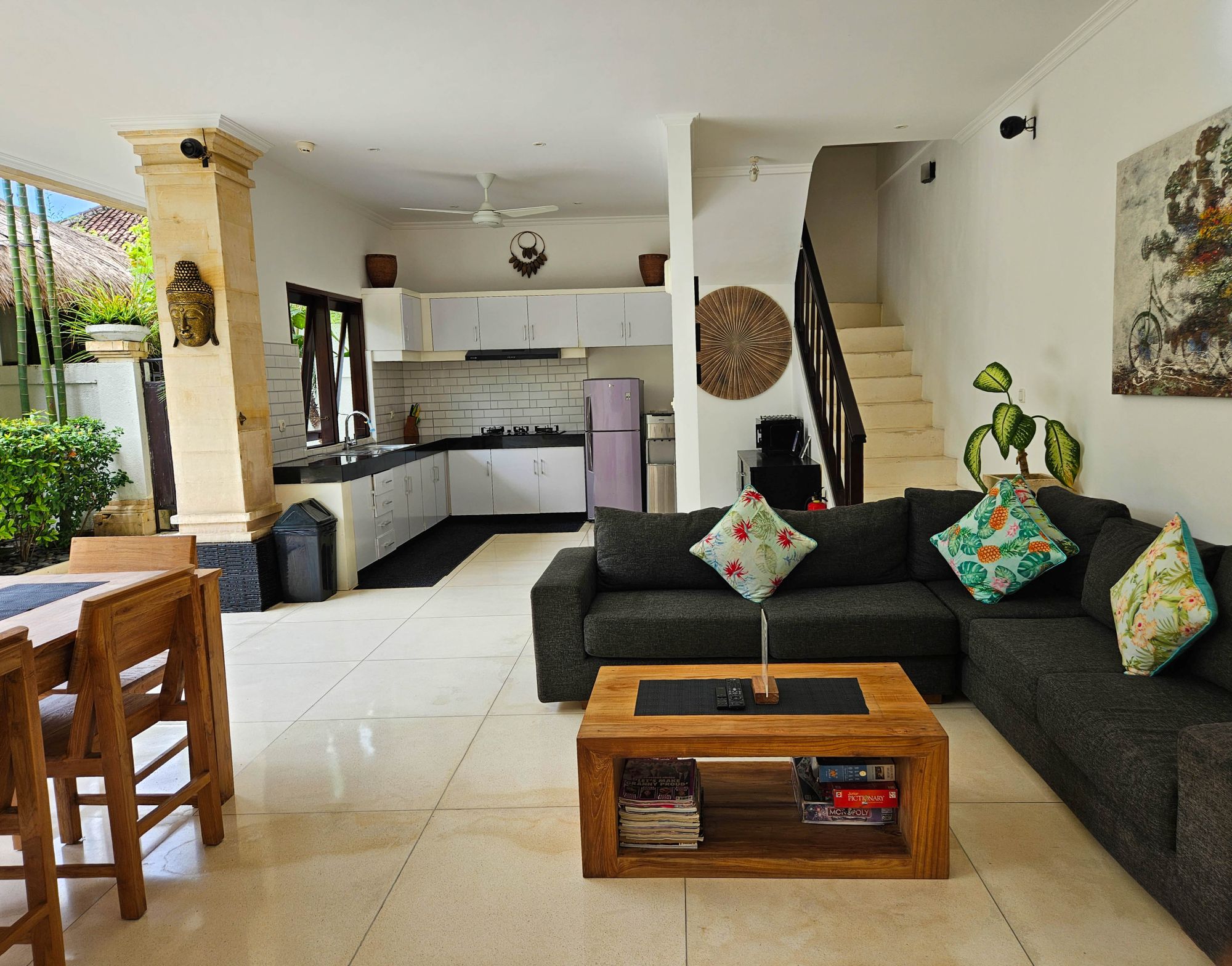 High-ceiling Balinese architectural design of the main living area at Villa Krisna Seminyak by Villa Bugis Seminyak villas.