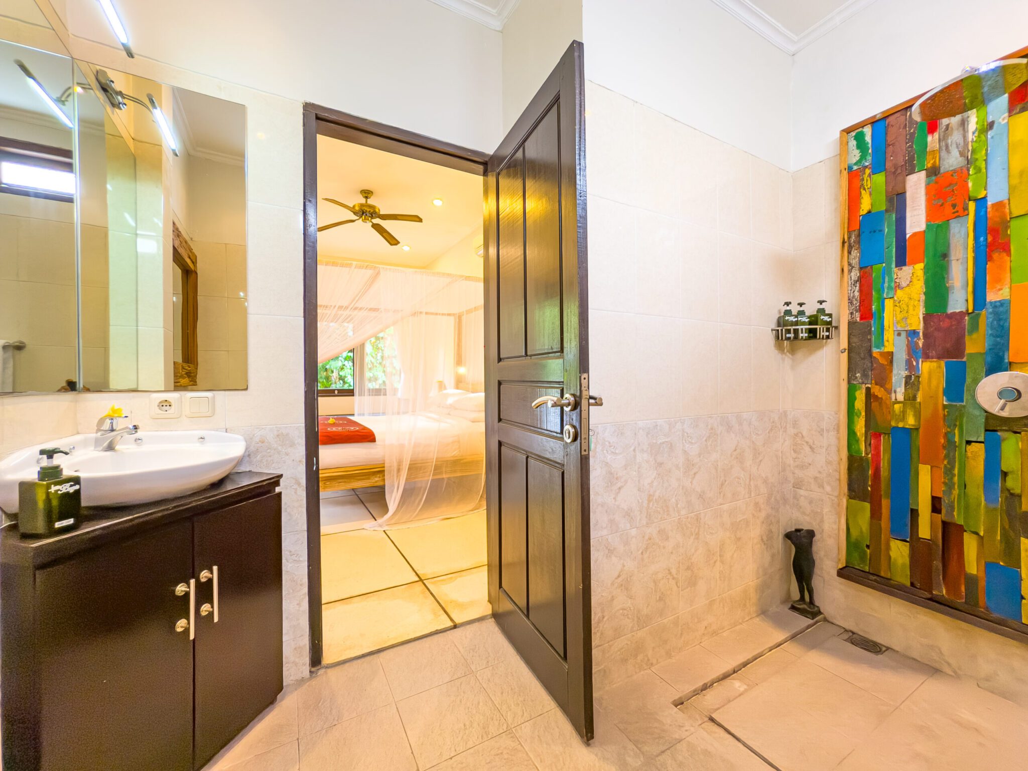 Pristine vanity setup and clean shower space inside the private bathroom of bedroom 2 at Villa Nakula Seminyak by Villa Bugis villa Seminyak.