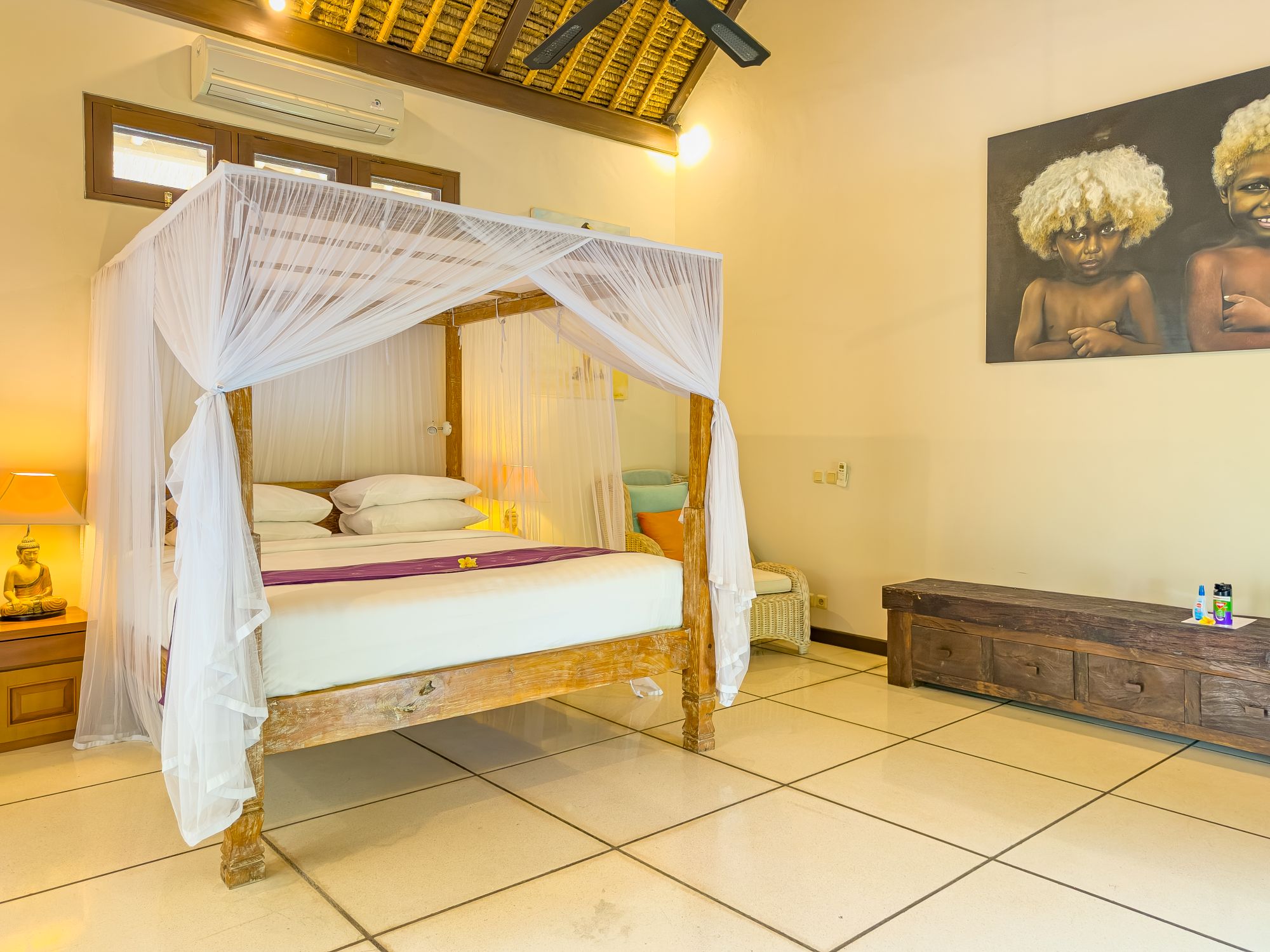 Elegant master bedroom featuring a comfortable king-size bed with tropical decor at Villa Nakula Seminyak by Villa Bugis, a top-rated villa Seminyak.