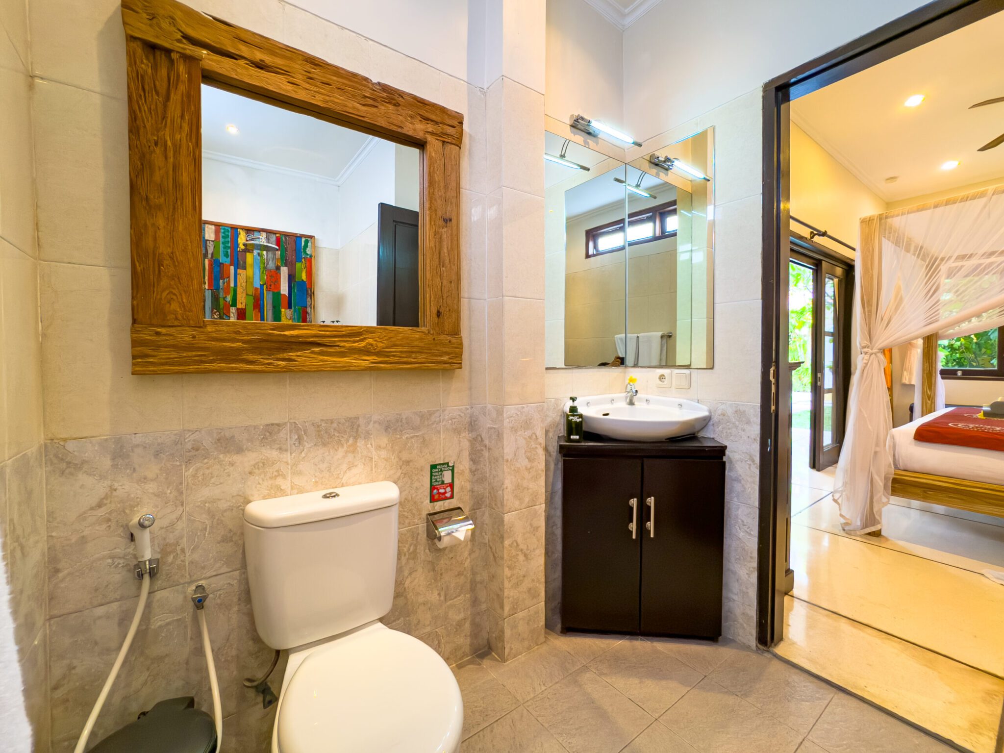 Private ensuite bathroom with modern fixtures for bedroom 2 at Villa Nakula Seminyak by Villa Bugis Seminyak villas.