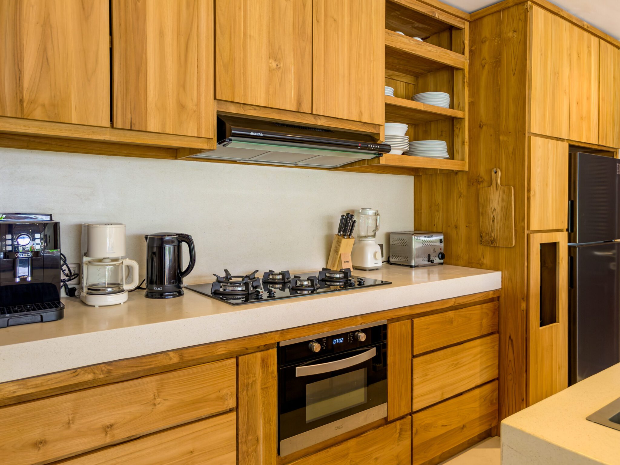 Spacious kitchen counter and dining preparation area at Villa Olive Seminyak by Villa Bugis, offering self-catering convenience in Seminyak villas.