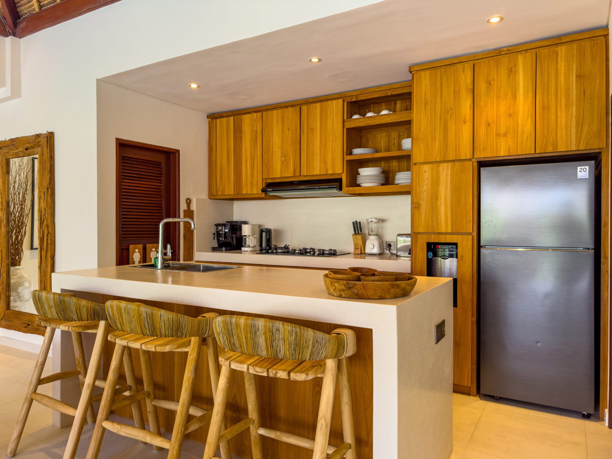 Modern open-concept kitchen fully equipped with high-quality appliances at Villa Olive Seminyak by Villa Bugis villa Seminyak.