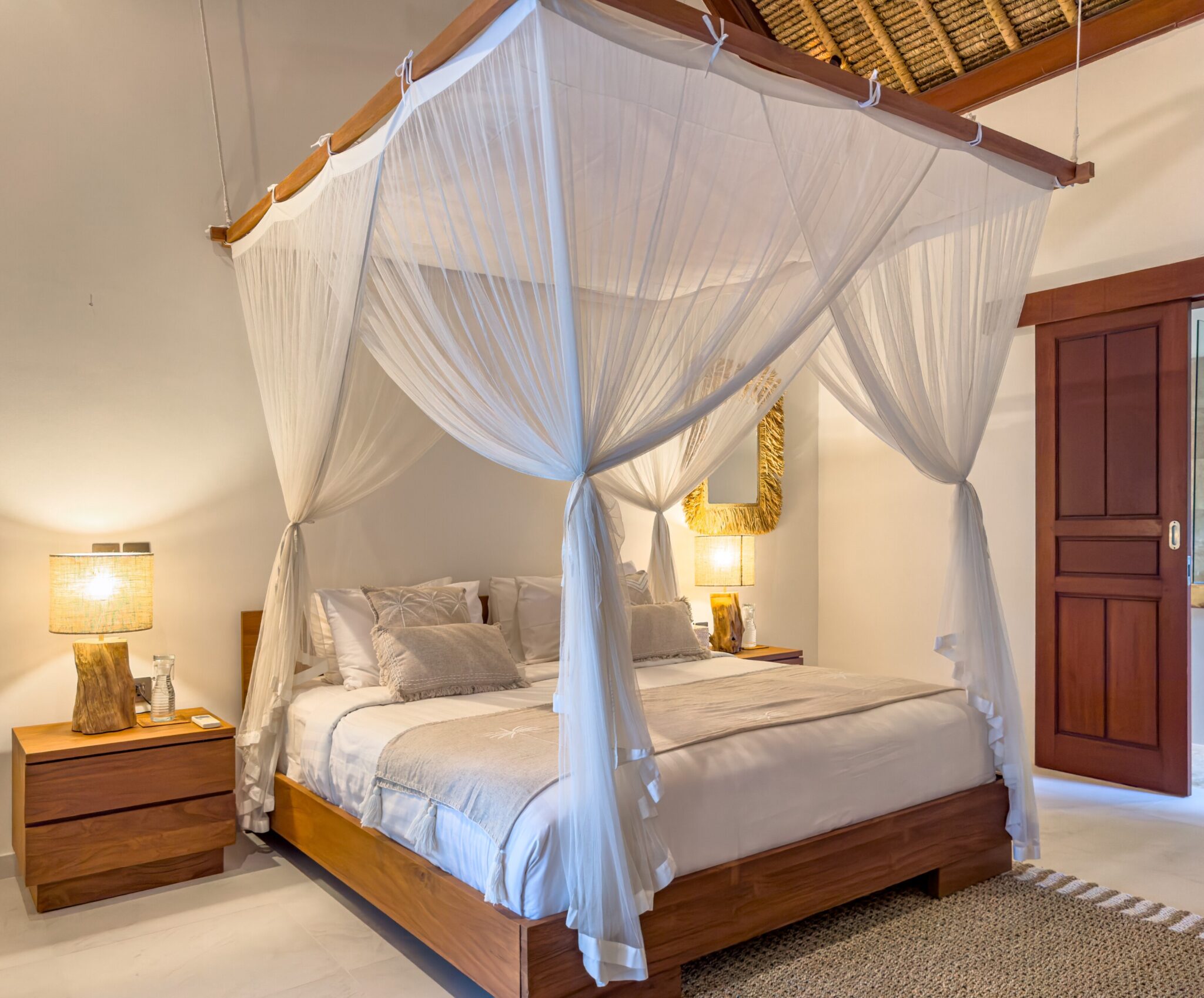 Cozy second bedroom with a comfortable king-size bed and warm lighting at Villa Olive Seminyak by Villa Bugis, ideal for Seminyak villas guests.