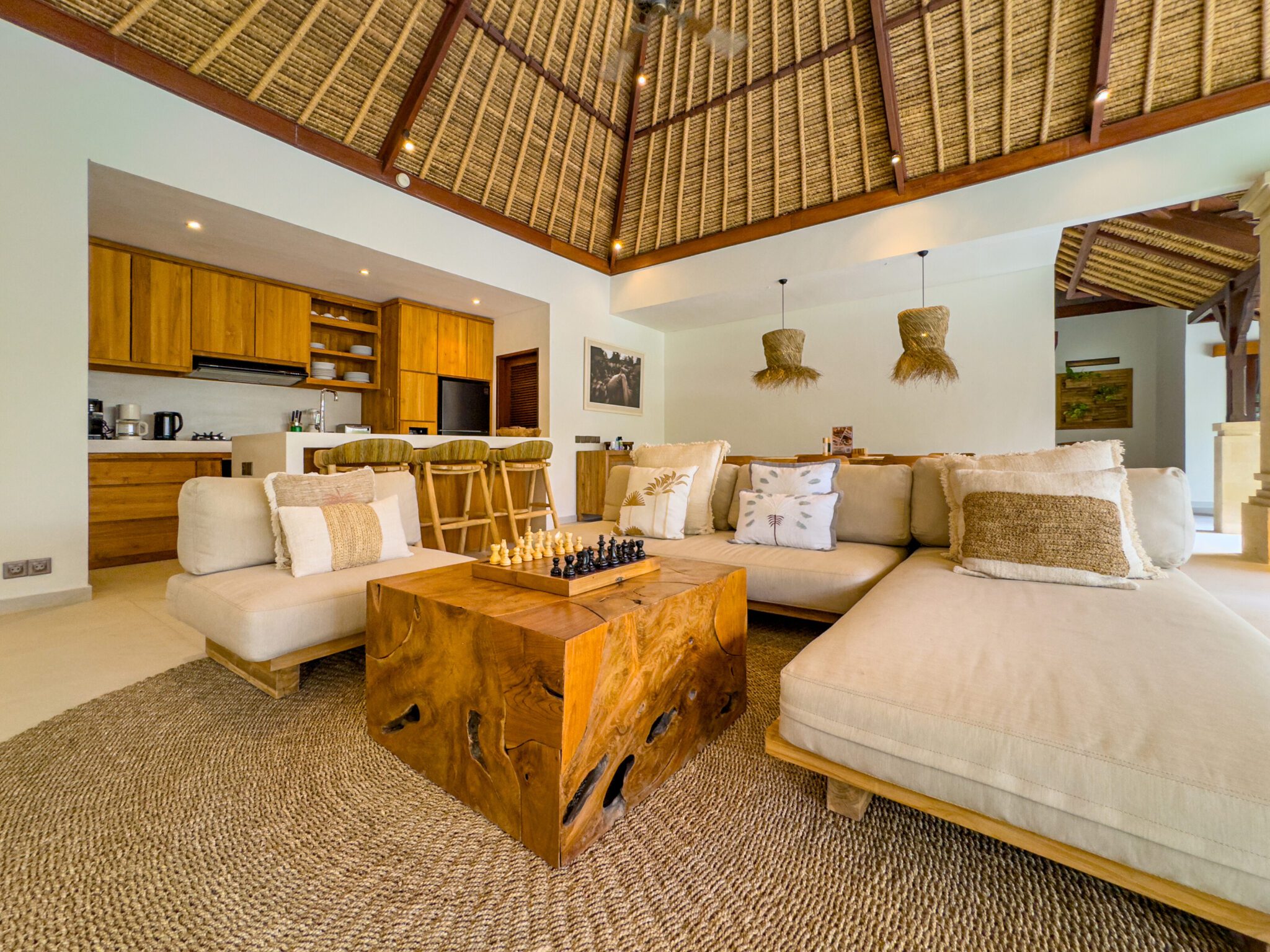 High-ceiling Balinese architectural design of the main living area at Villa Olive Seminyak by Villa Bugis Seminyak villas.