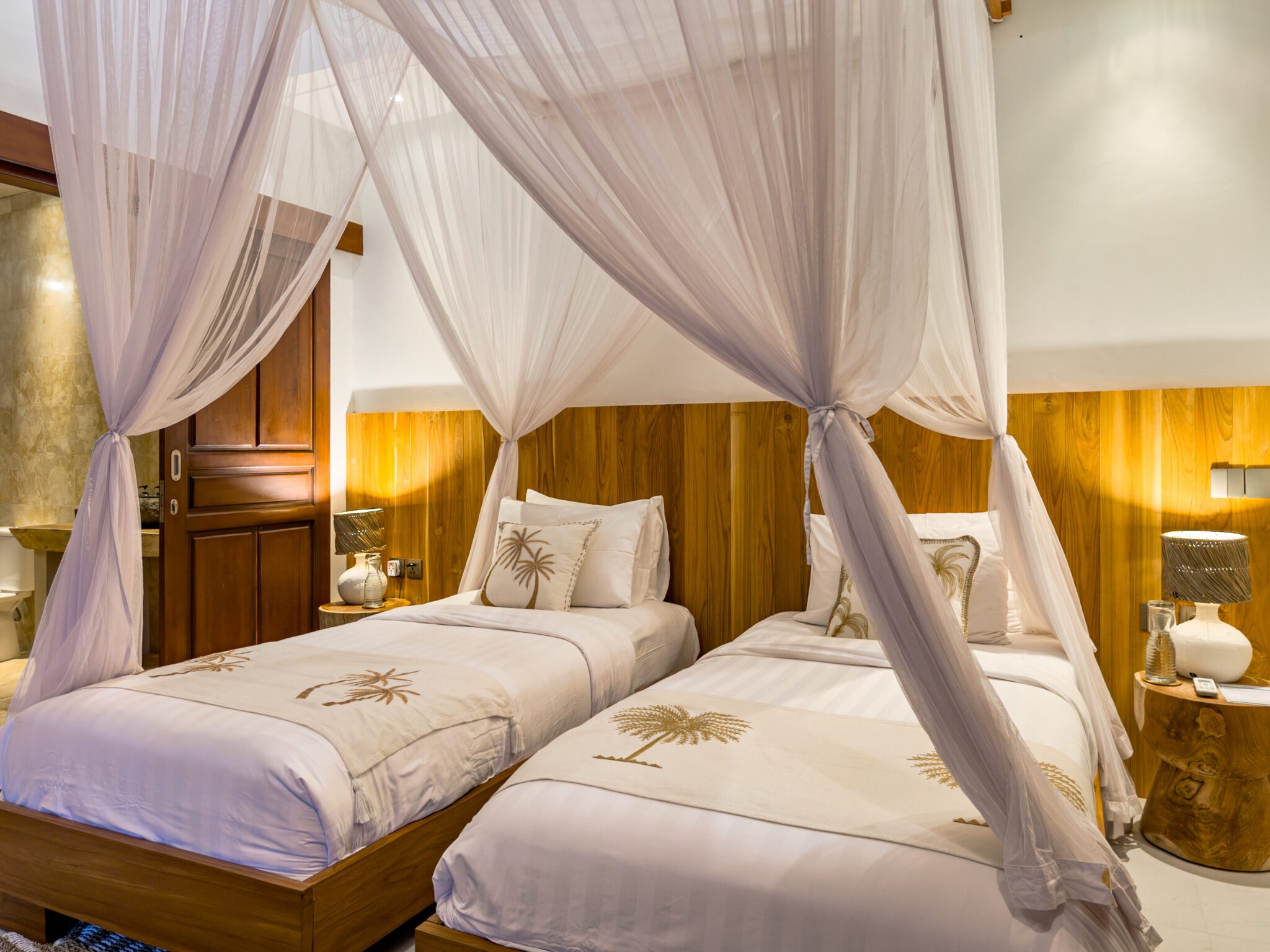 Guest bedroom 3 featuring neatly arranged twin beds at Villa Olive Seminyak by Villa Bugis, offering flexible arrangements in a 3-bedroom villa Seminyak.