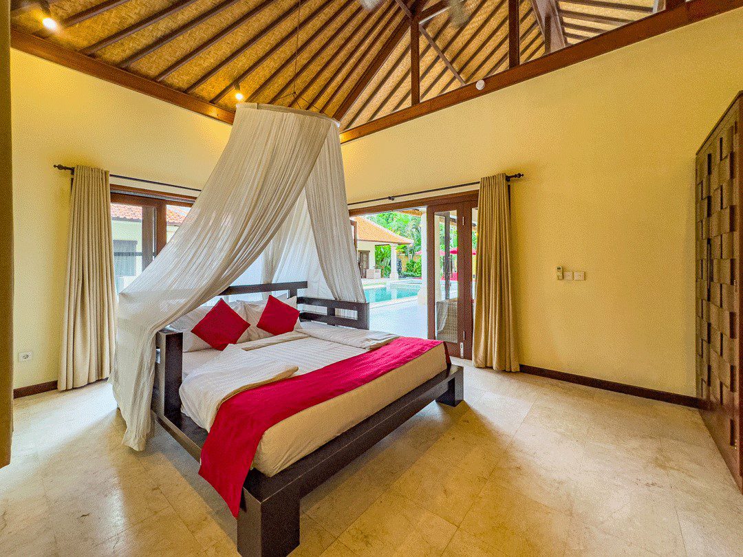 Comfortable fourth bedroom with a king-size bed at Villa Santi Seminyak by Villa Bugis, offering quiet privacy in a spacious 4-bedroom villa Seminyak.