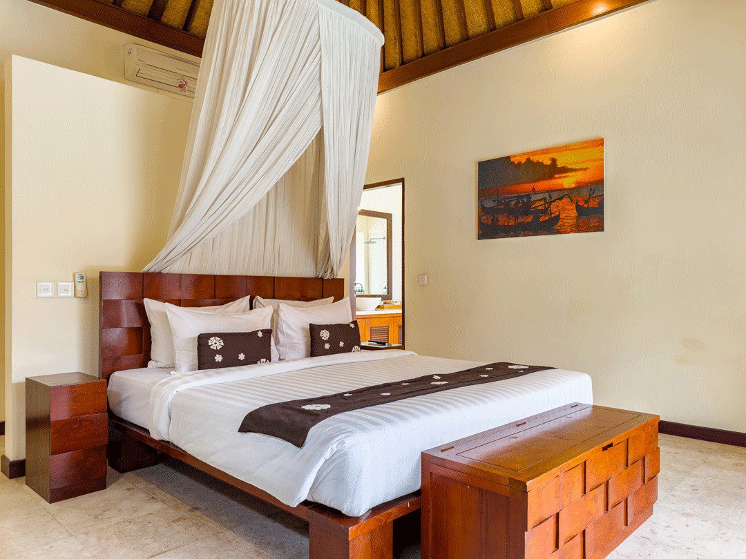 Guest bedroom 2 featuring a comfortable king-size bed at Villa Santi Seminyak by Villa Bugis, part of a spacious 4-bedroom villa Seminyak.