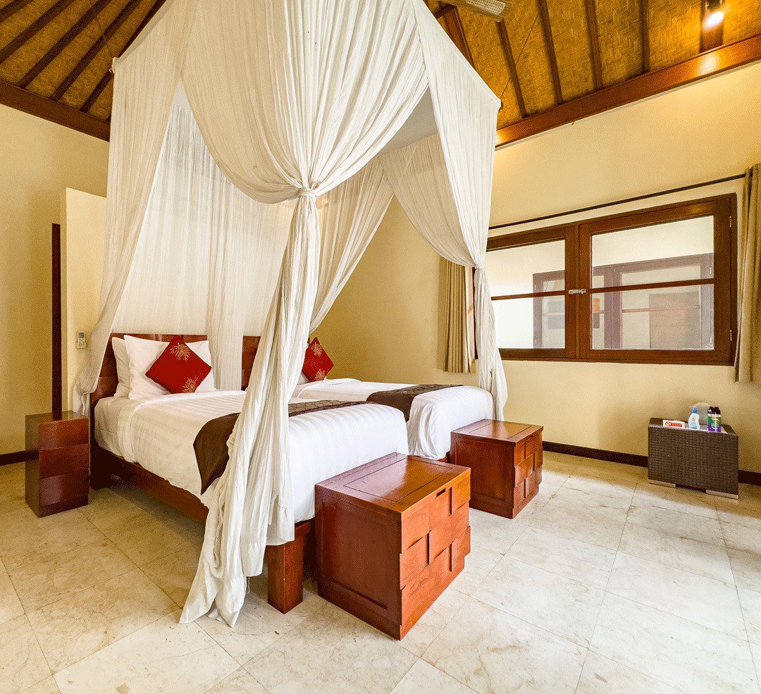 Tastefully decorated twin bed layout of bedroom 3 at Villa Santi Seminyak by Villa Bugis villa Seminyak, featuring soft natural daylighting.