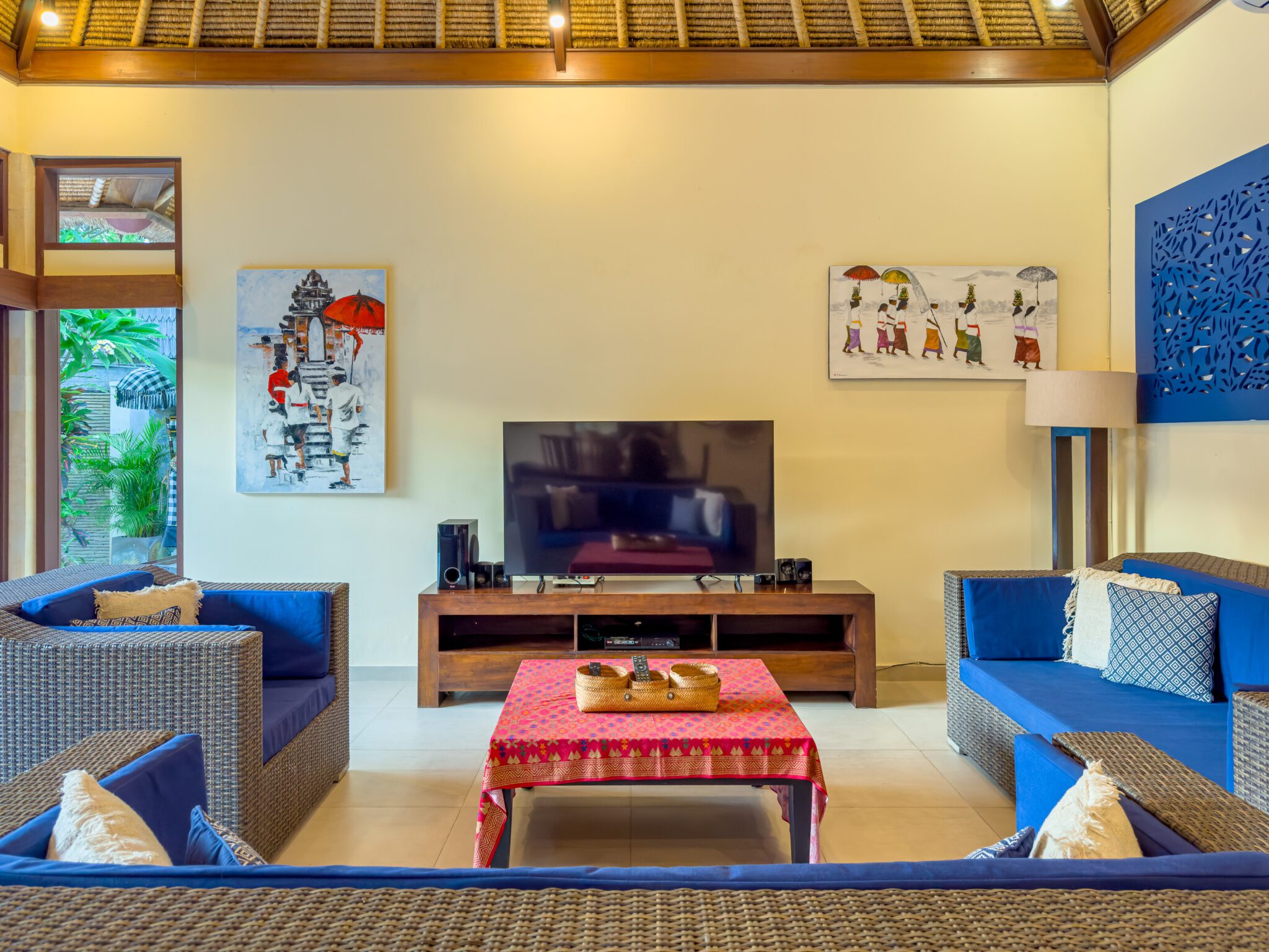 Elegant wooden decor and cozy entertainment seating in the living pavilion at Villa Saphir Seminyak by Villa Bugis Seminyak villas.