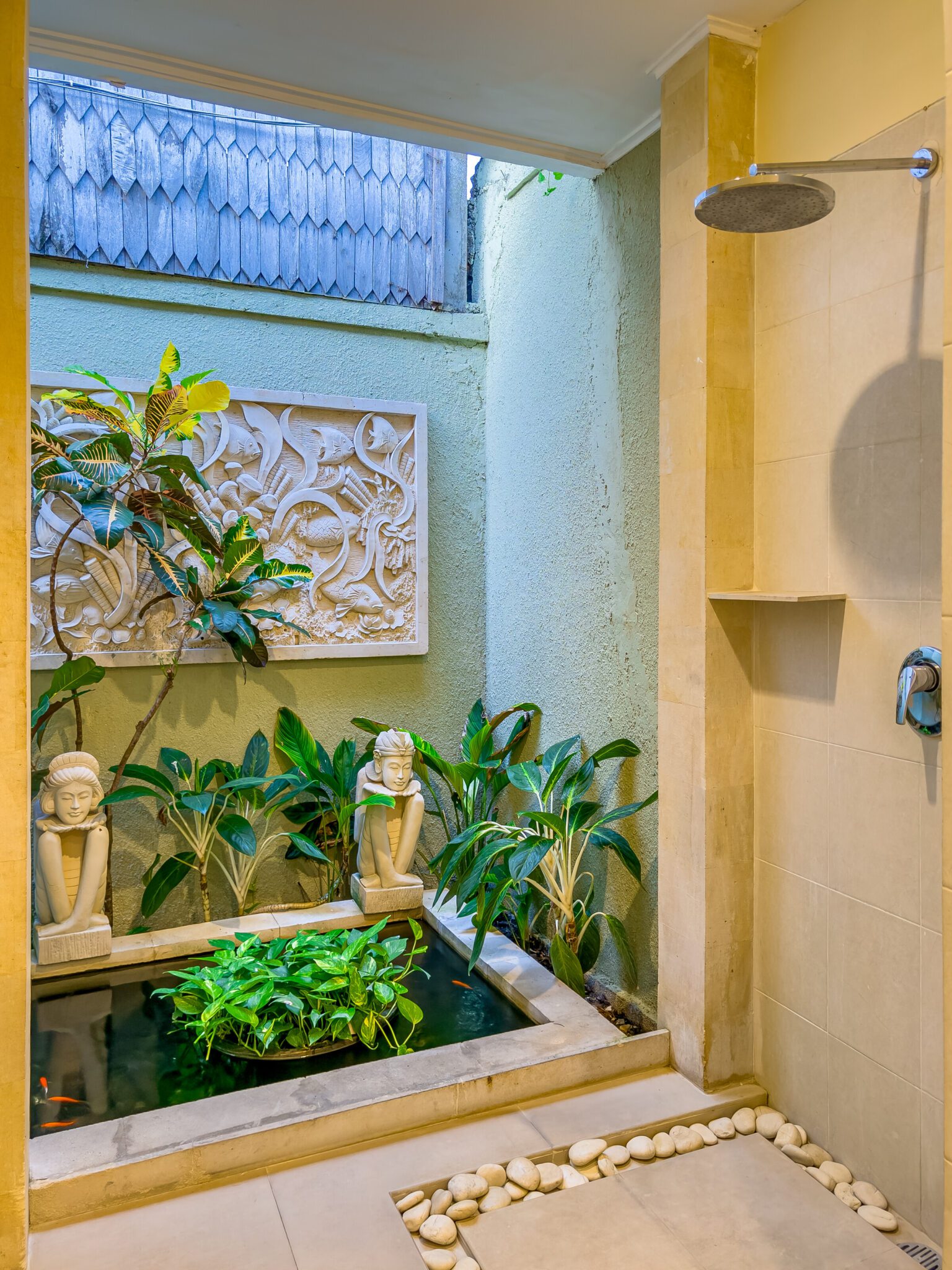 Clean vanity sink and modern shower facilities in bathroom 4 at Villa Saphir Seminyak by Villa Bugis Seminyak villas.