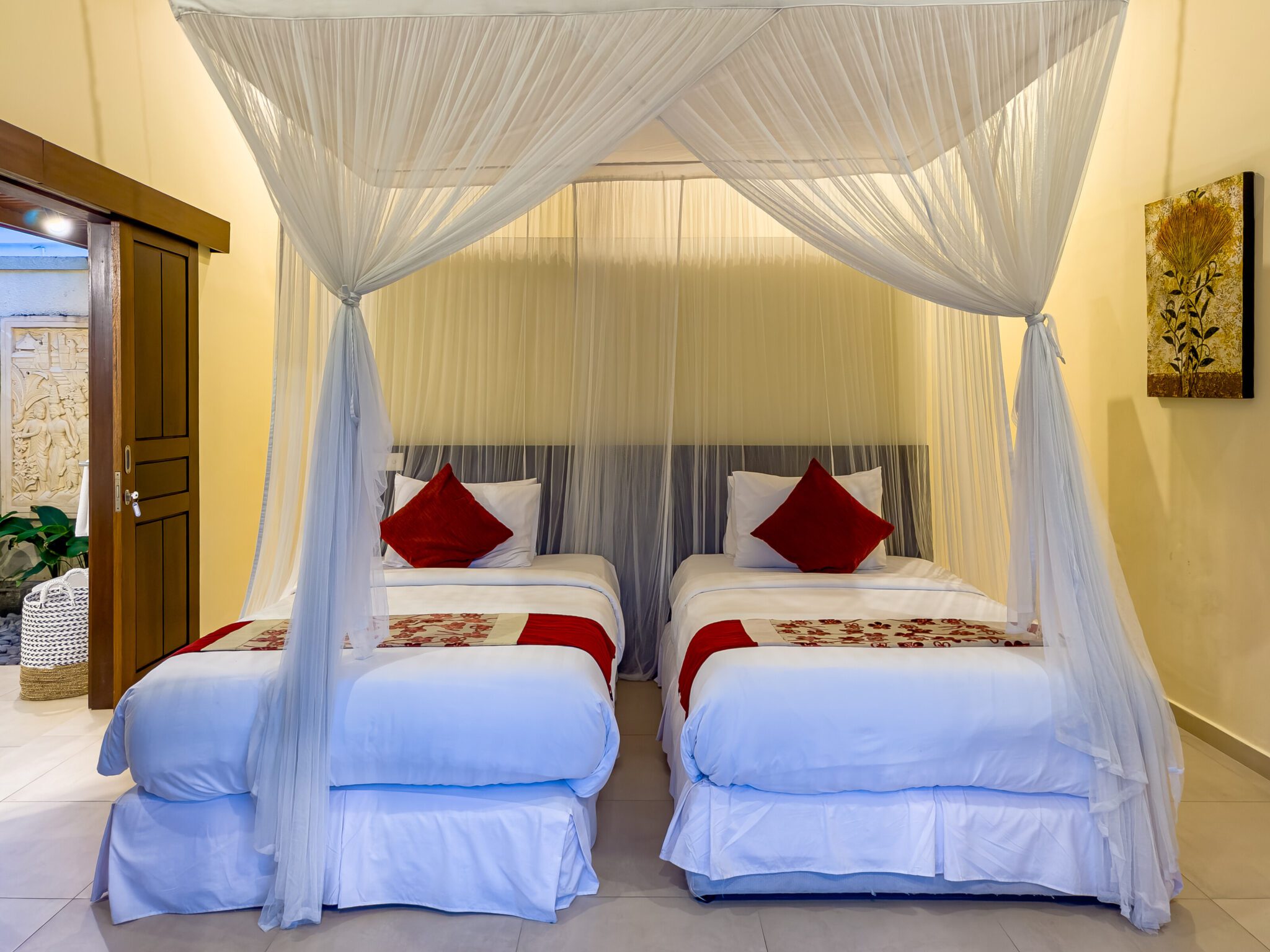 Guest bedroom 2 featuring neatly arranged twin beds at Villa Saphir Seminyak by Villa Bugis, offering flexible arrangements in a 4-bedroom villa Seminyak.
