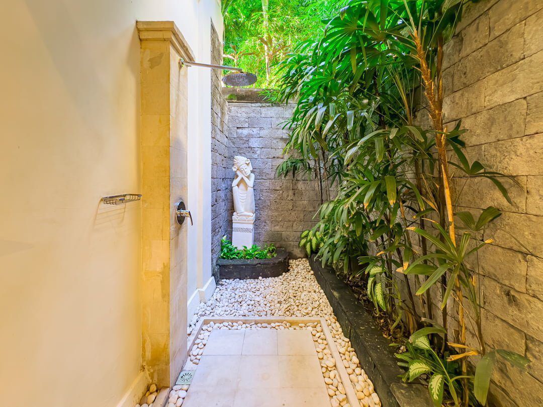 Private open-air ensuite bathroom with modern fixtures attached to twin bedroom 2 at Villa Tresna Seminyak by Villa Bugis Seminyak villas.