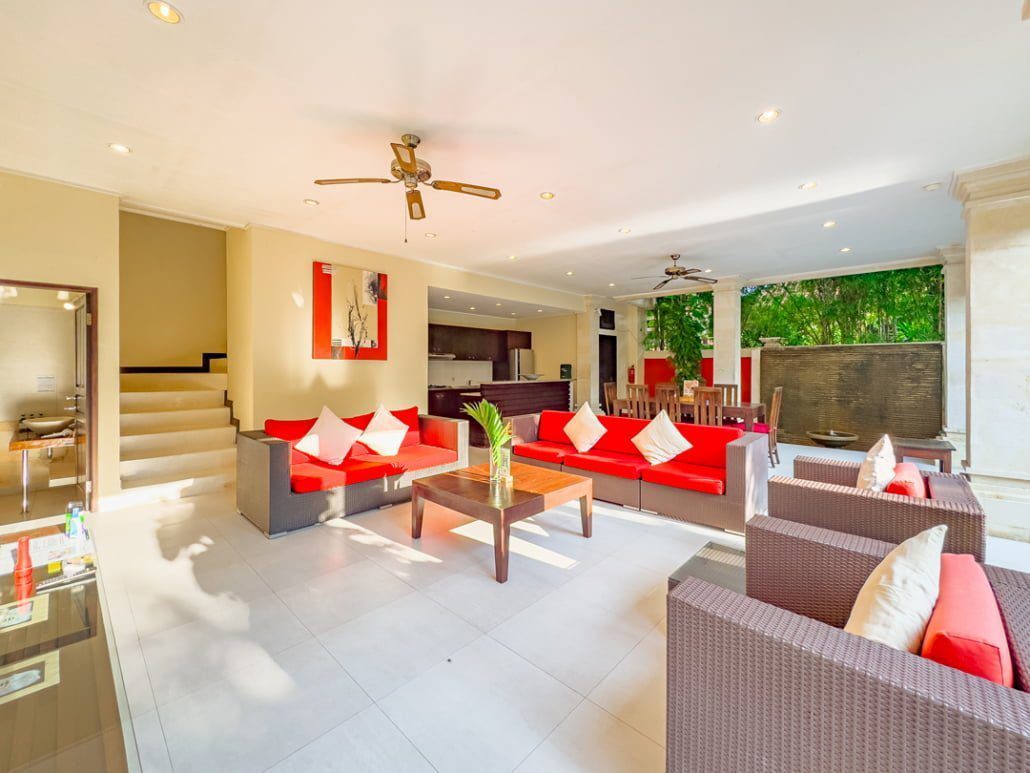 High-ceiling Balinese architectural design of the main living and dining area at Villa Tresna Seminyak by Villa Bugis Seminyak villas.