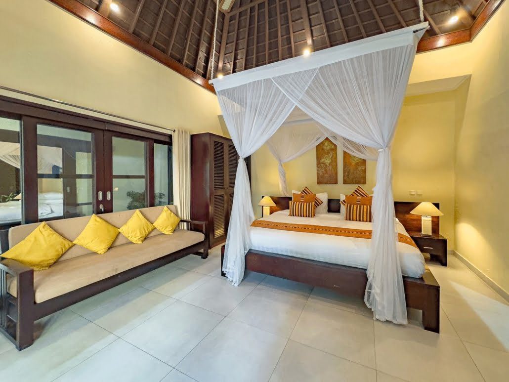 Tastefully decorated interior layout of bedroom 3 at Villa Tresna Seminyak by Villa Bugis Seminyak villas, featuring soft natural daylighting.