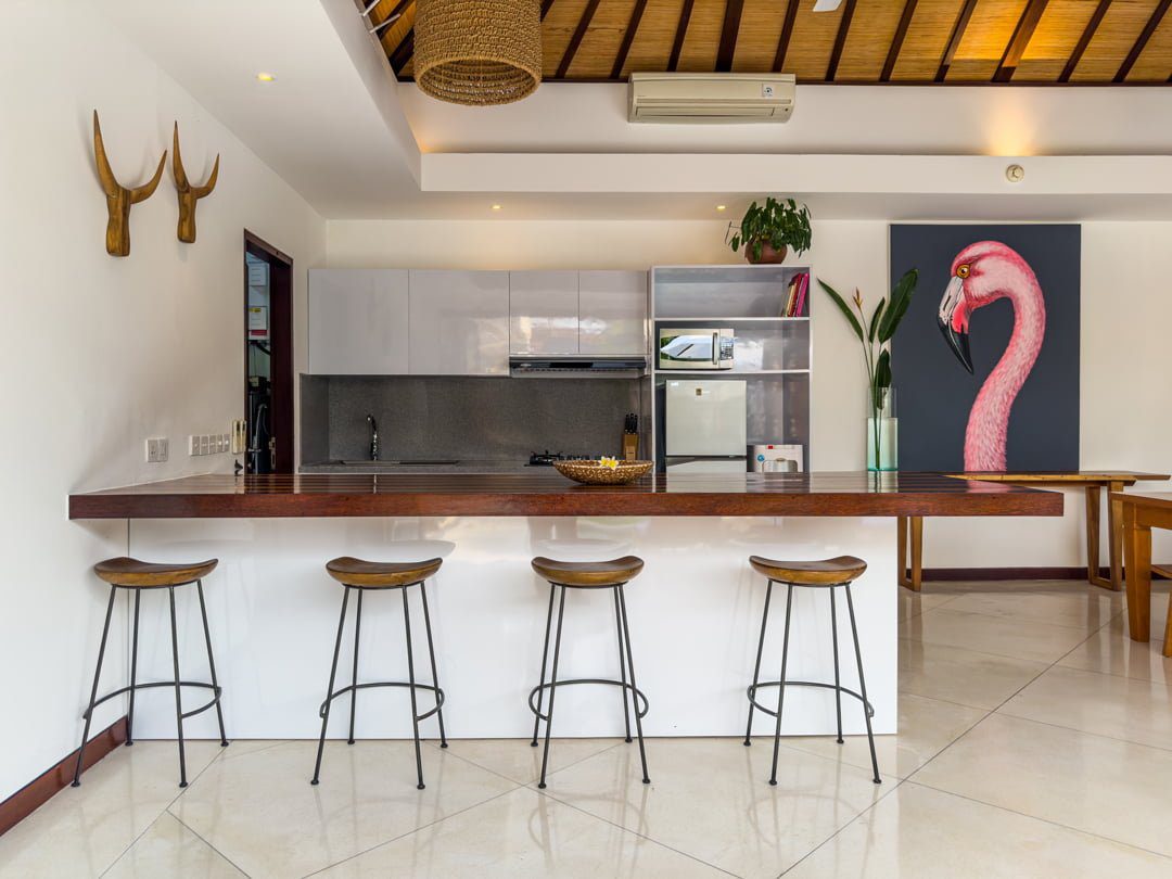 Modern open-concept kitchen fully equipped with high-quality appliances at Villa Umah Kupu-Kupu 2 Seminyak by Villa Bugis villa Seminyak.
