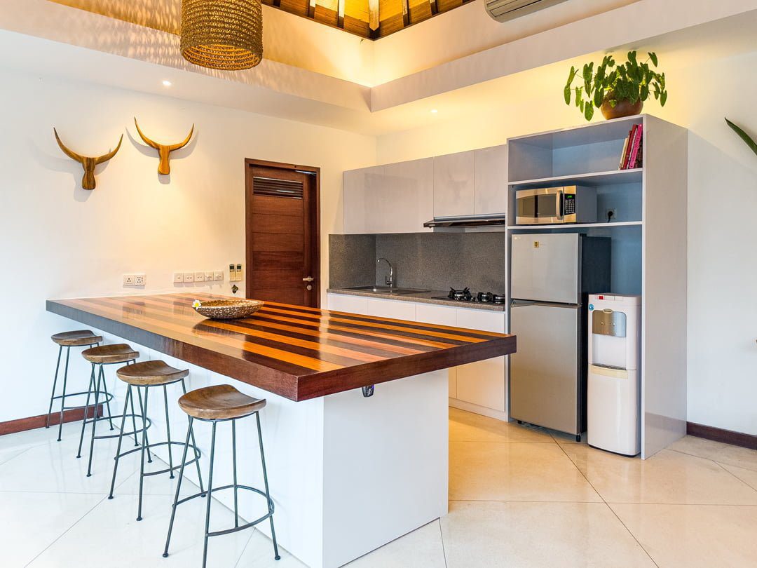 Spacious kitchen counter and dining preparation area at Villa Umah Kupu-Kupu 2 Seminyak by Villa Bugis, offering self-catering convenience in Seminyak villas.
