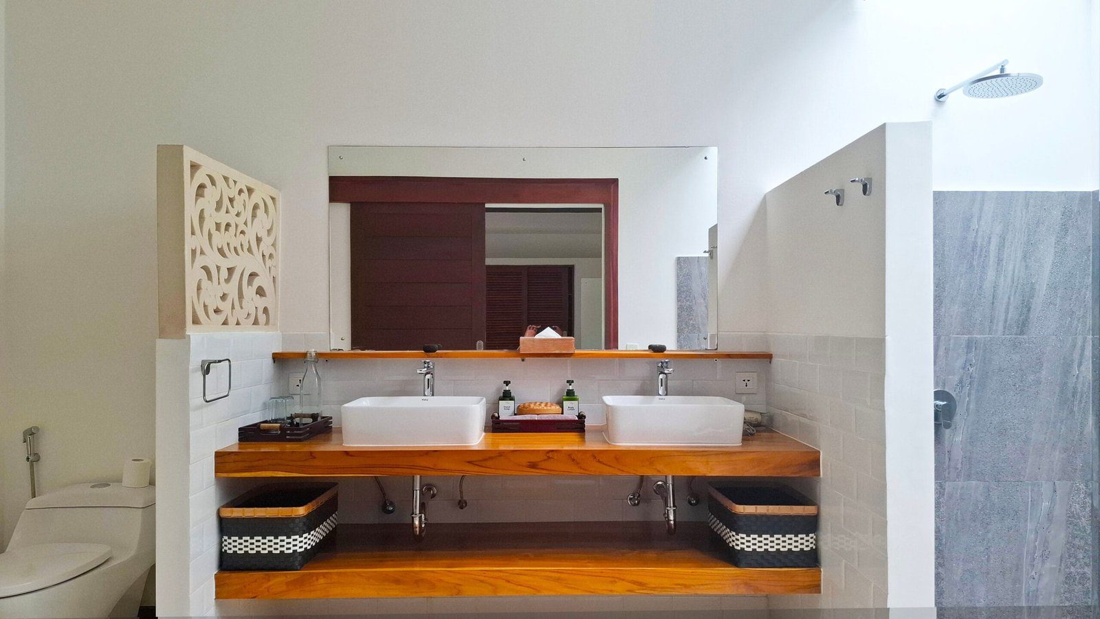 Tropical semi-outdoor ensuite bathroom attached to bedroom 1 at Villa Umah Kupu-Kupu 2 Seminyak by Villa Bugis, offering a unique villa Seminyak experience.