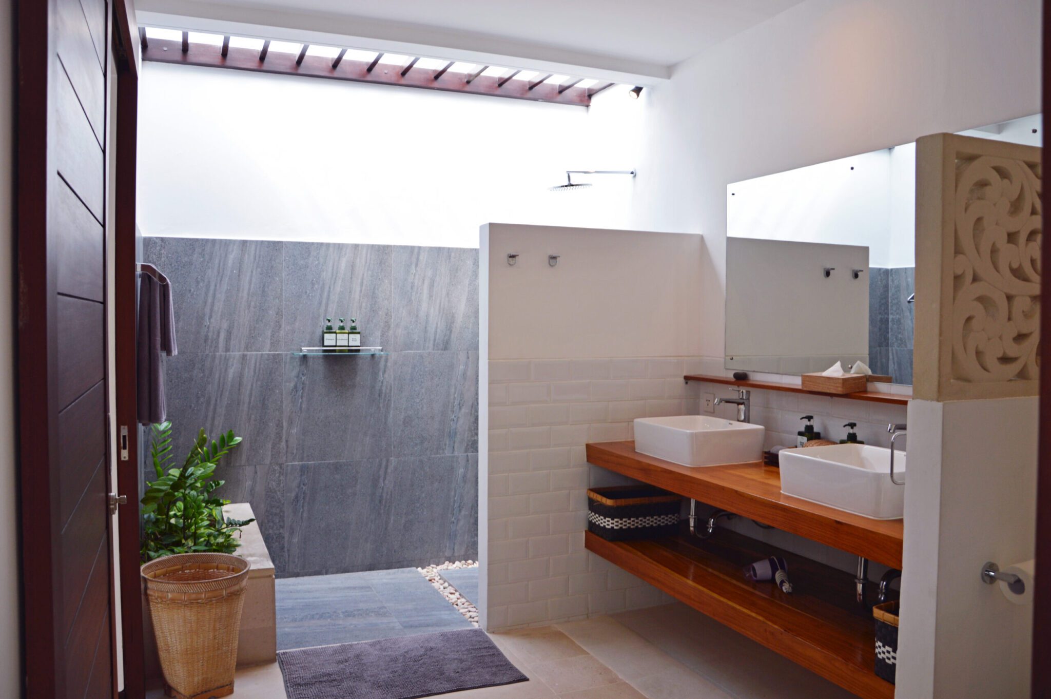 Private ensuite bathroom with clean modern fixtures for bedroom 2 at Villa Umah Kupu-Kupu 2 Seminyak by Villa Bugis Seminyak villas.