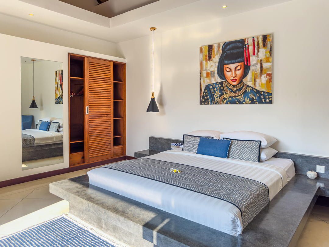 Tastefully decorated interior layout of bedroom 2 at Villa Umah Kupu-Kupu 2 Seminyak by Villa Bugis villa Seminyak, featuring soft natural daylighting.
