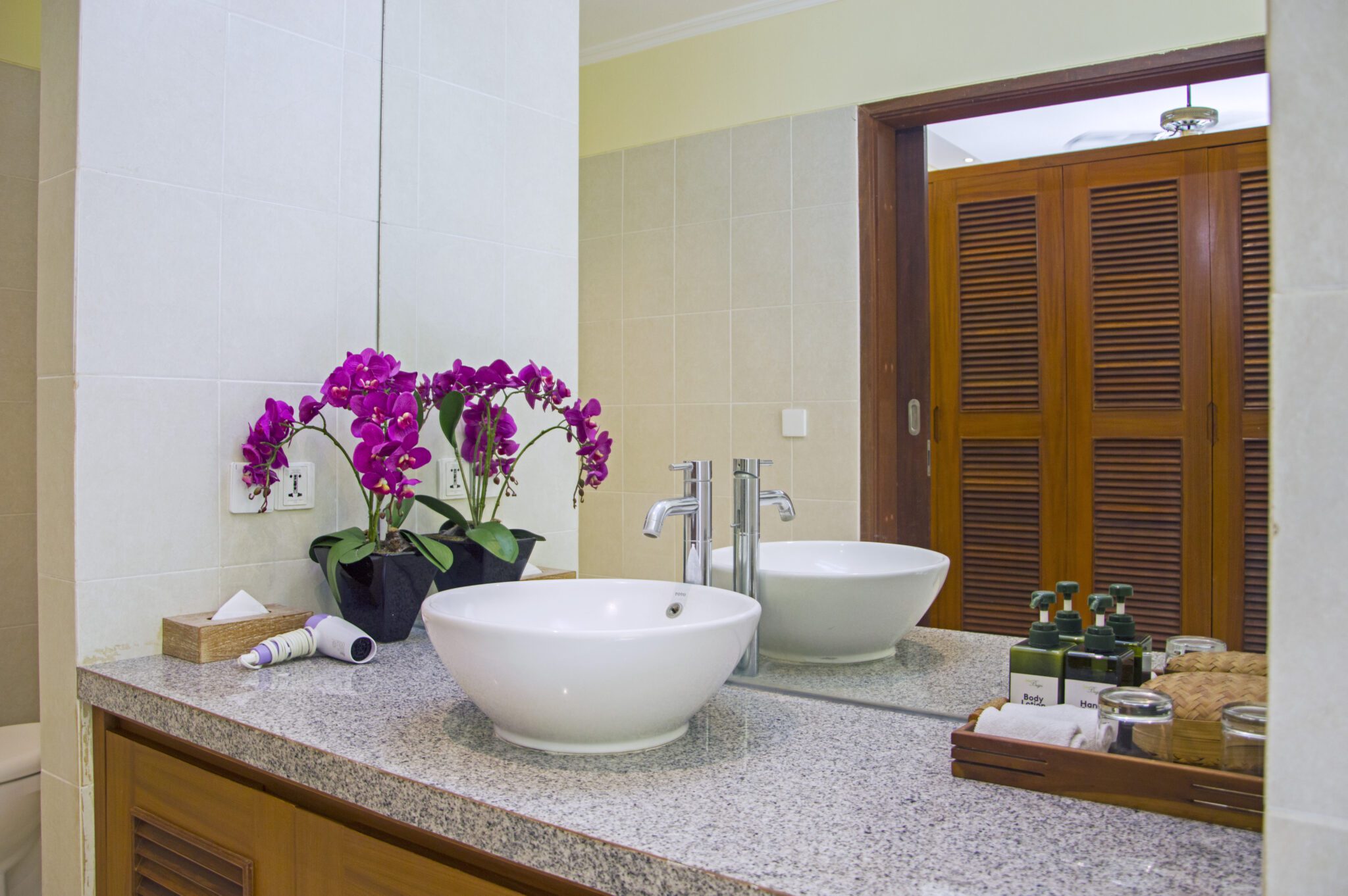 Well-lit vanity and pristine toilet facilities in bathroom 4 at Villa Vara Seminyak by Villa Bugis villa Seminyak.