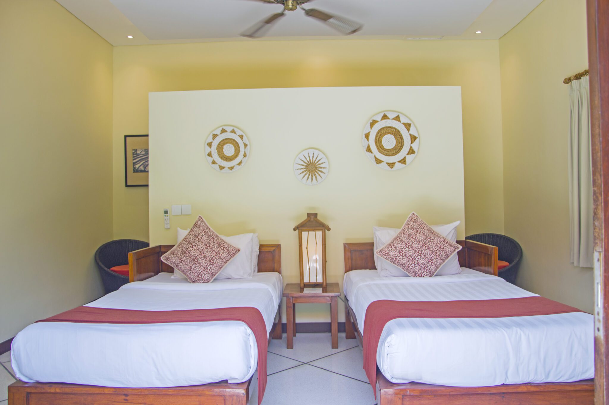 Airy interior layout of twin bedroom 4 at Villa Vara Seminyak by Villa Bugis villa Seminyak, equipped with air conditioning and tropical decor.