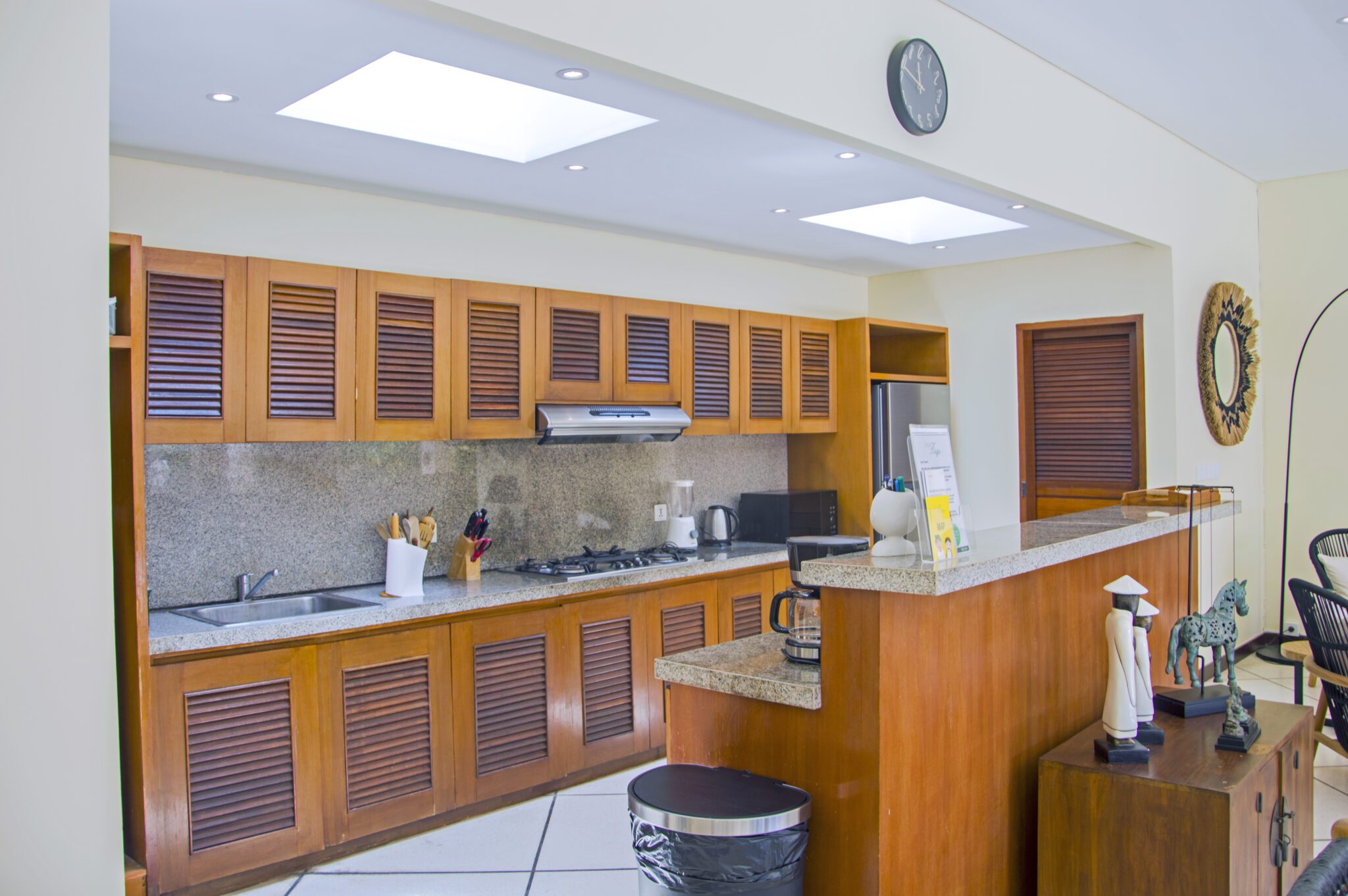 Modern open-concept kitchen fully equipped with high-quality appliances at Villa Vara Seminyak by Villa Bugis villa Seminyak.