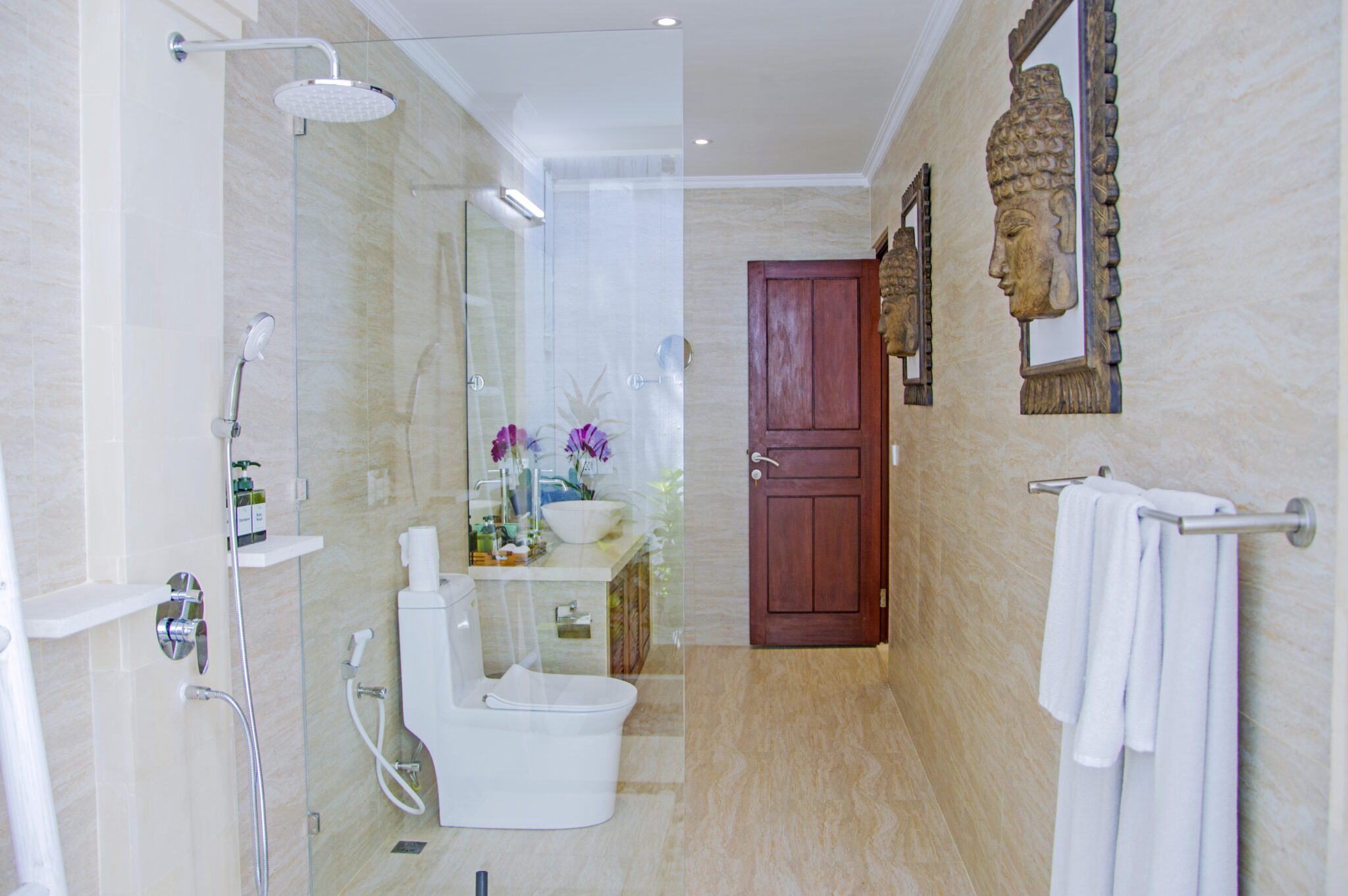 Clean vanity mirror and modern shower facilities in the bathroom of bedroom 3 at Villa Vara Seminyak by Villa Bugis villa Seminyak.