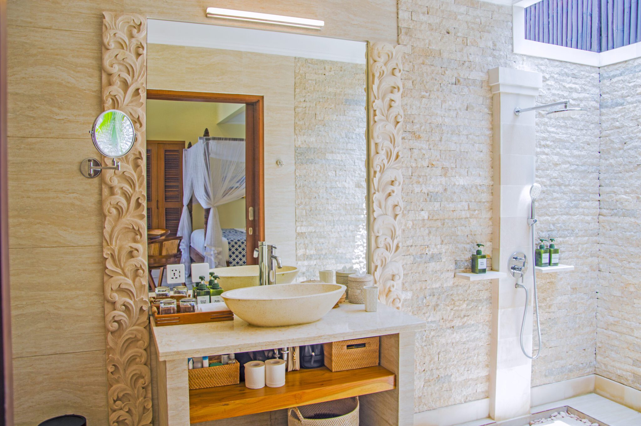 Clean modern vanity, stone basin, and refreshing shower area in the master bathroom at Villa Vara Seminyak by Villa Bugis Seminyak villas.