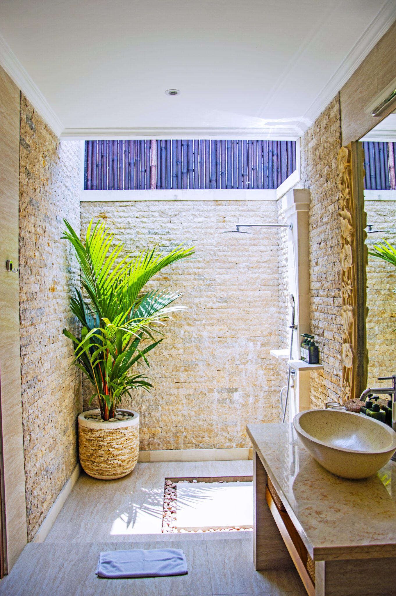 Private open-air ensuite bathroom with modern fixtures for bedroom 2 at Villa Vara Seminyak by Villa Bugis Seminyak villas.